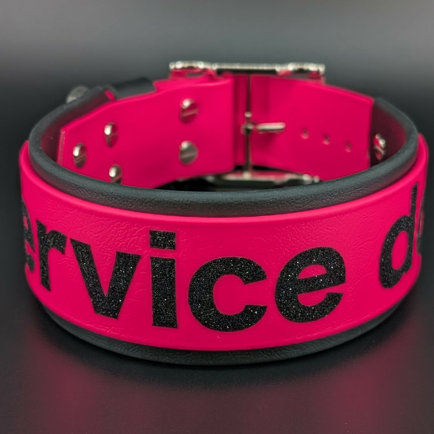 2 inch wide black and pink layered biothane service dog collar with glitter text