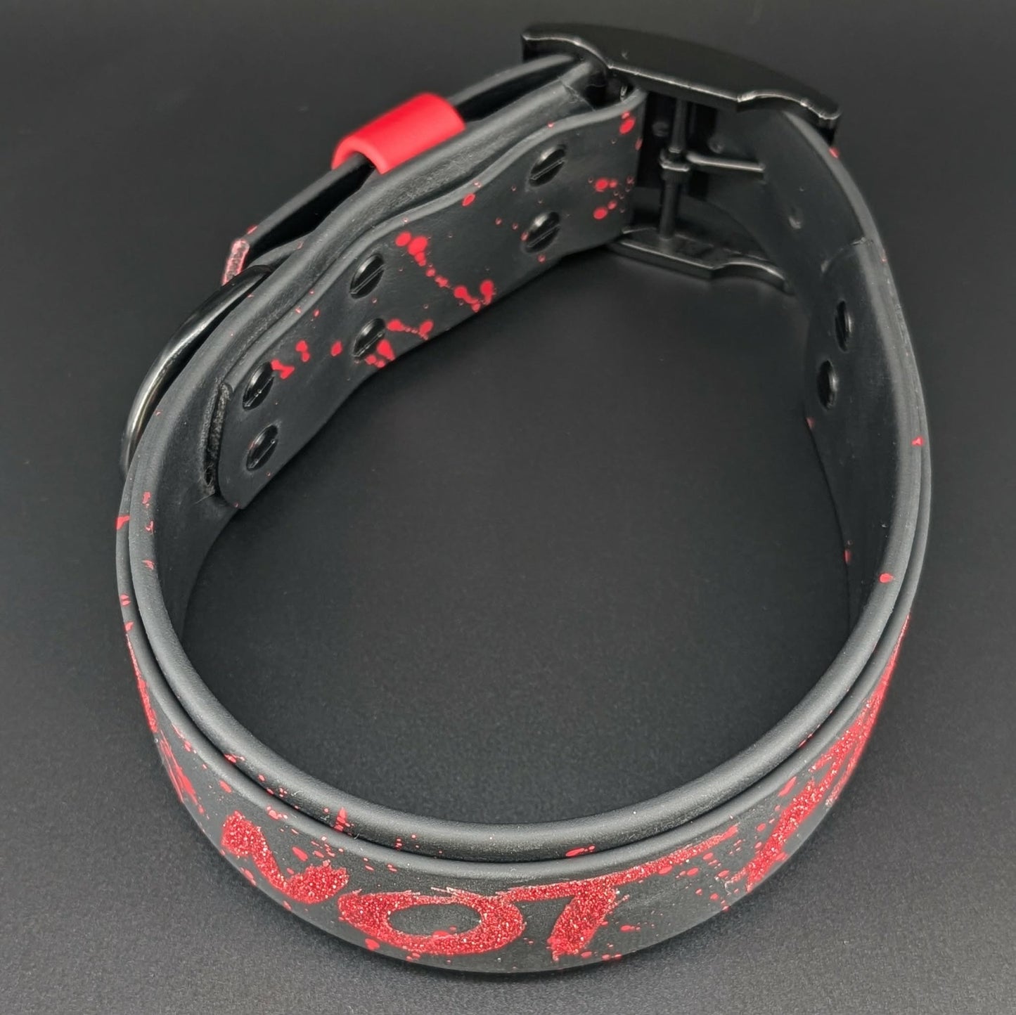 2 inch wide black layered biothane collar with red glitter do not pet text