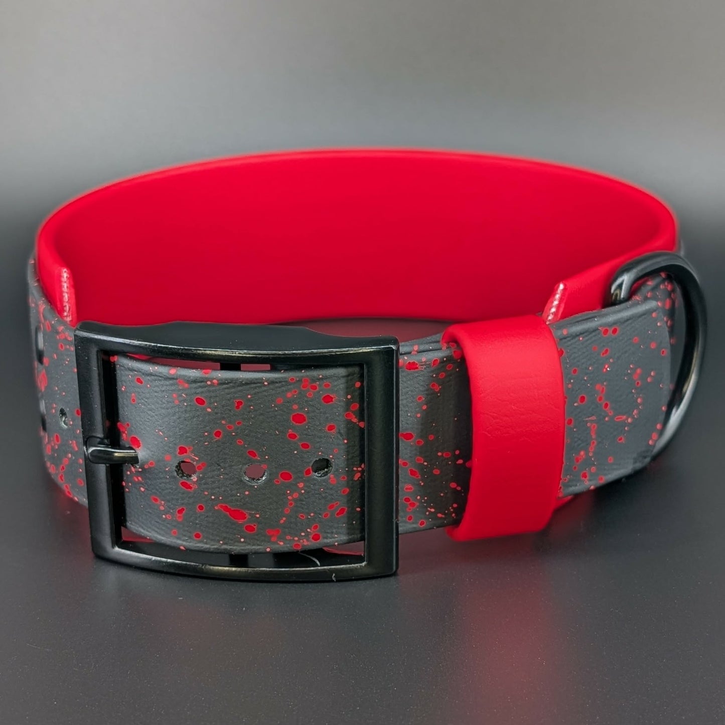 2 inch wide red and black layered biothane dog collar with red splatter paint