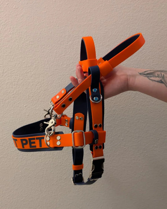 dark blue and orange biothane straight front service dog harness with built-in counterbalance handle and detachable pull strap