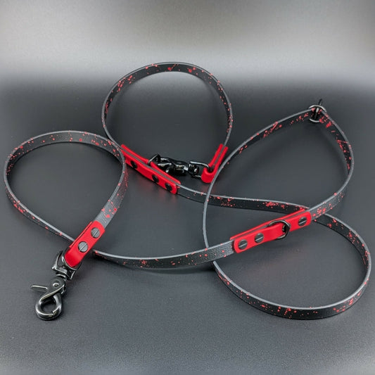 black and red biothane hands free dog leash with red splatter paint