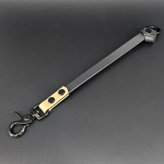 black and tan biothane knotted traffic tab with black hardware and fixed o ring