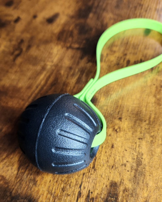 black ball tug with light green biothane loop handle