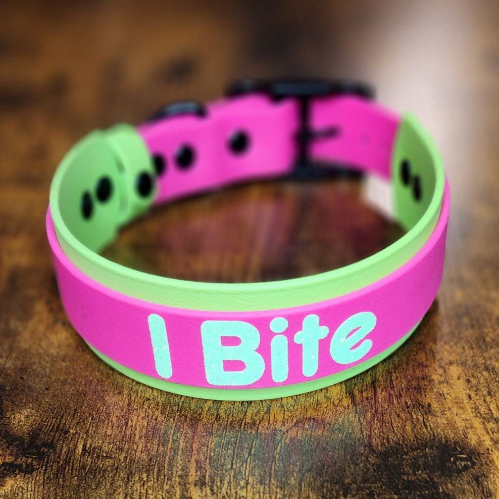 green and pink layered biothane dog collar with custom i bite text