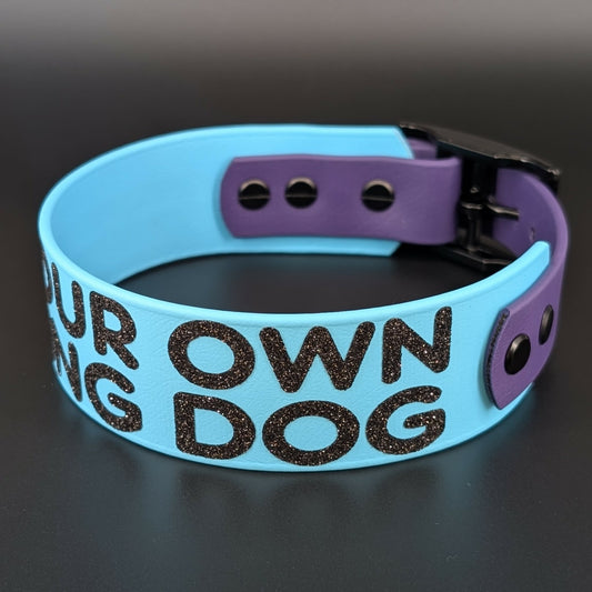 light blue and dark purple tapered biothane dog collar with glitter text