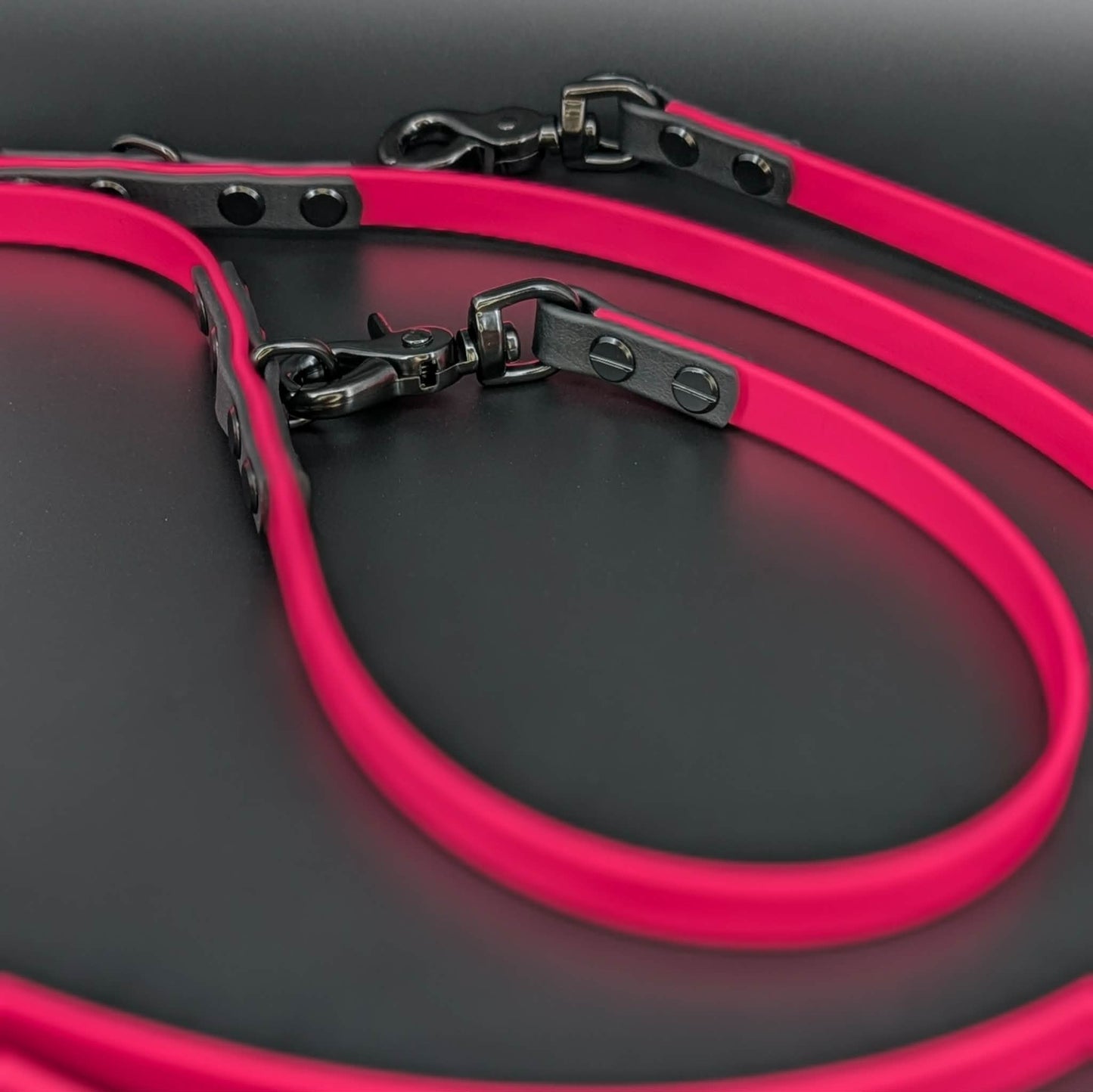 pink and black biothane hands free over the shoulder dog leash