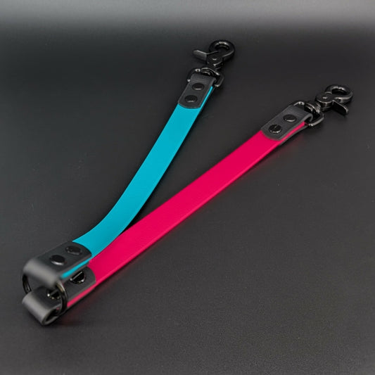 pink and light blue biothane leash coupler for walking two dogs