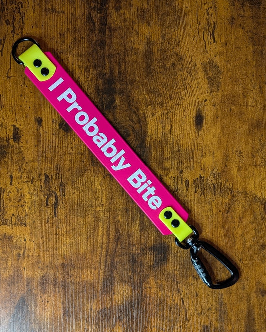 pink and yellow biothane leash extender warning with white glitter i probably bite text