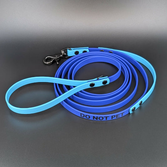 royal blue and light blue biothane long line with built in traffic handle and do not pet text