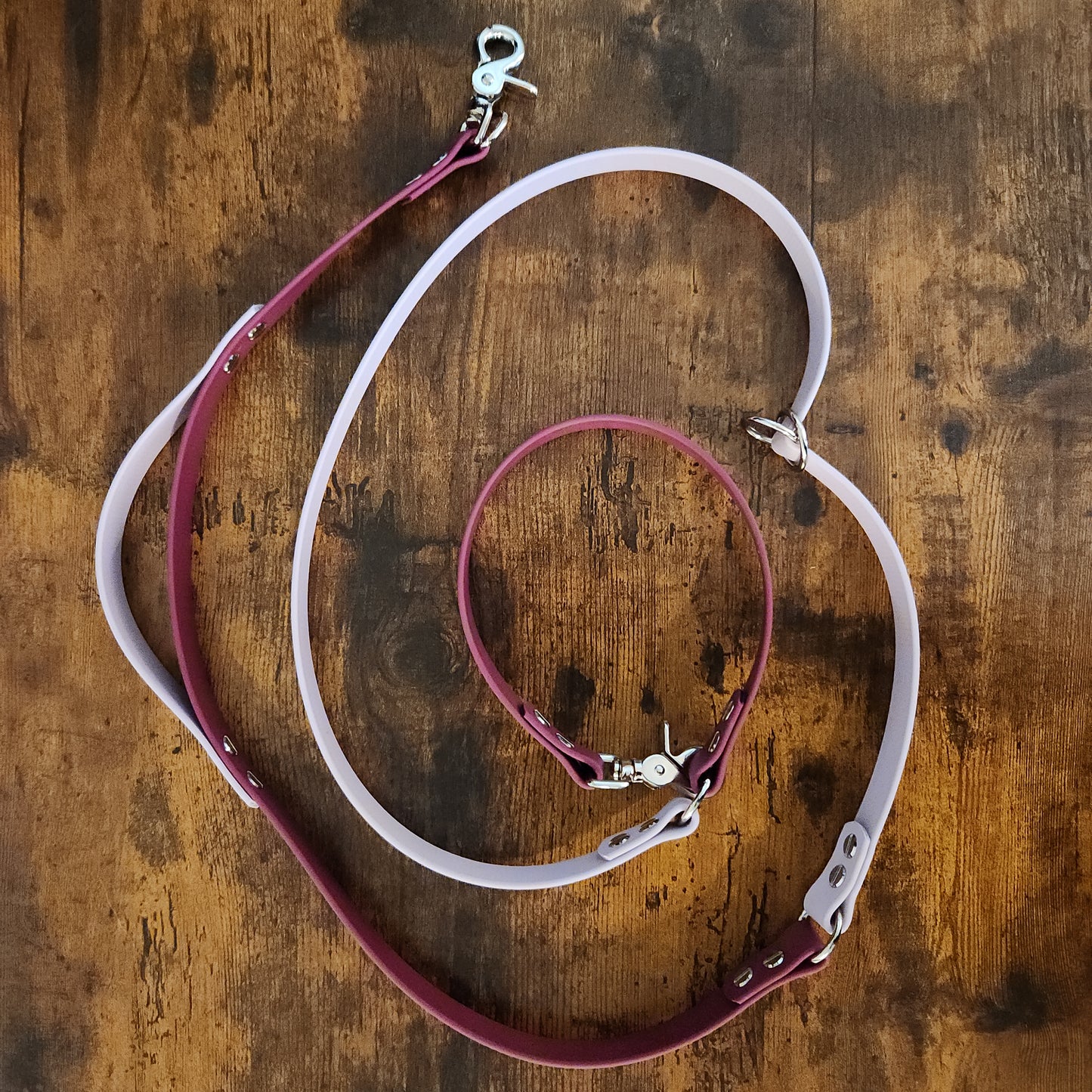 wine and lavender biothane hands free over the shoulder leash with built-in traffic handle and adjustable waist attachment point