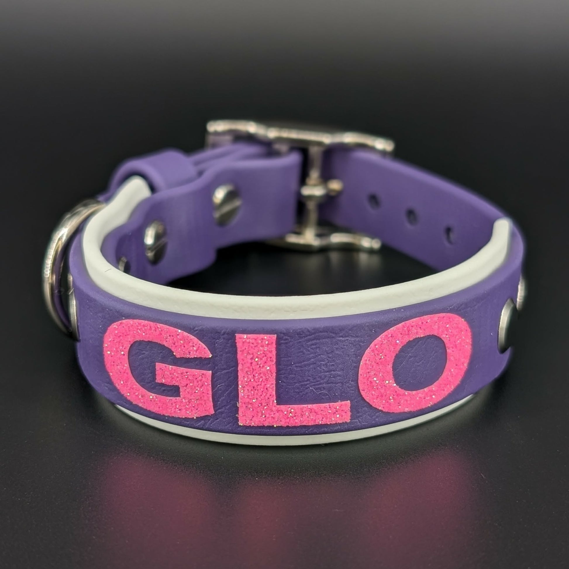 1 inch wide white and dark purple layered biothane dog collar with custom glitter text