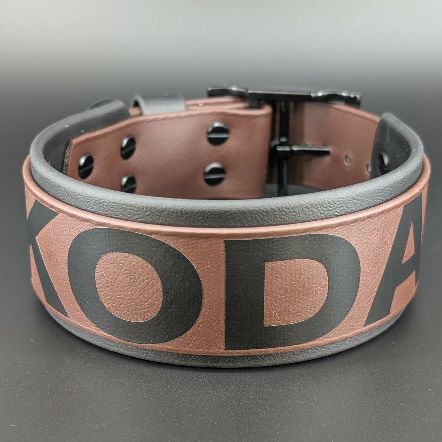 2 inch wide black and dark brown layered biothane dog collar with custom text