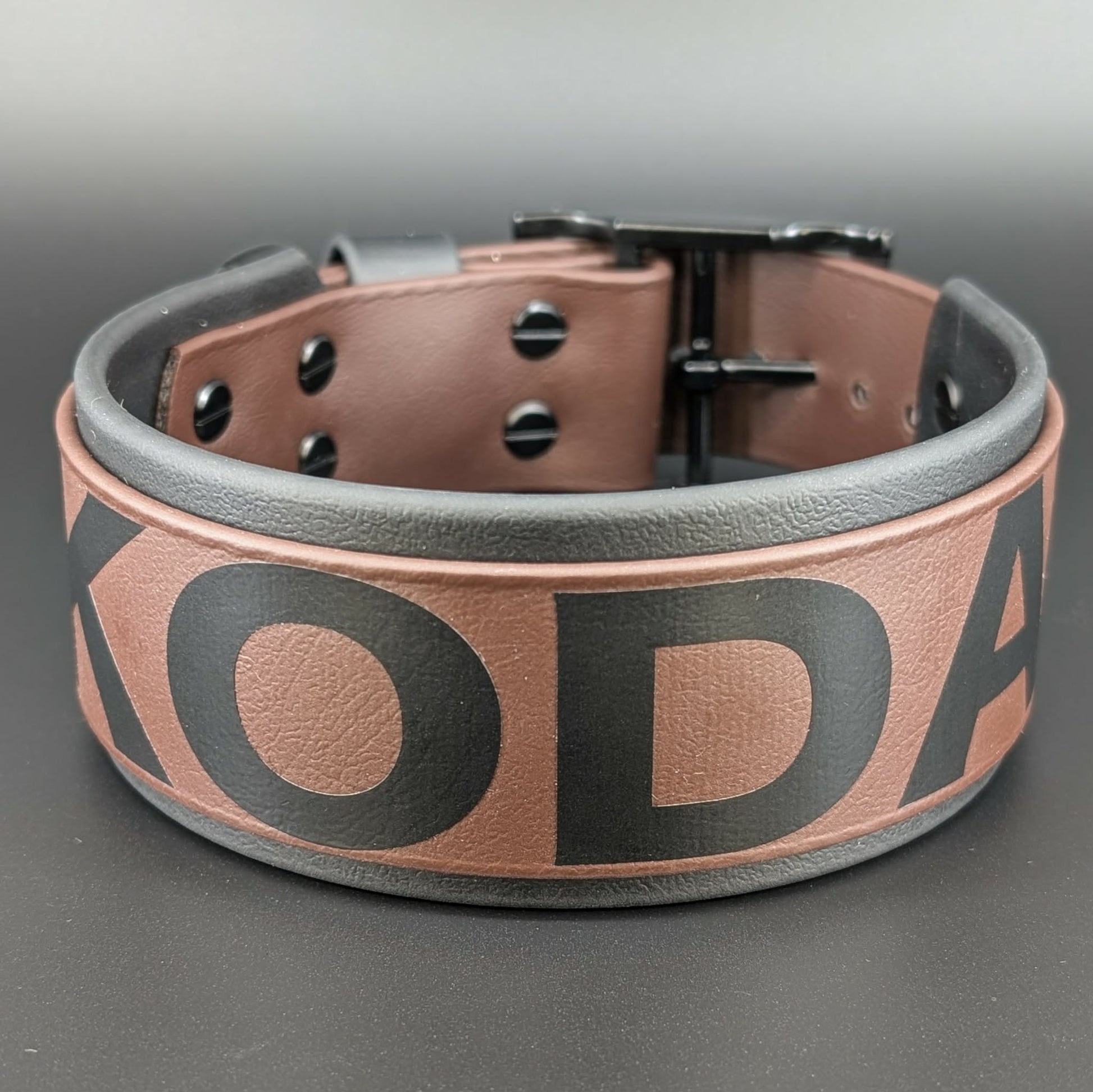 2 inch wide black and dark brown layered biothane dog collar with custom text