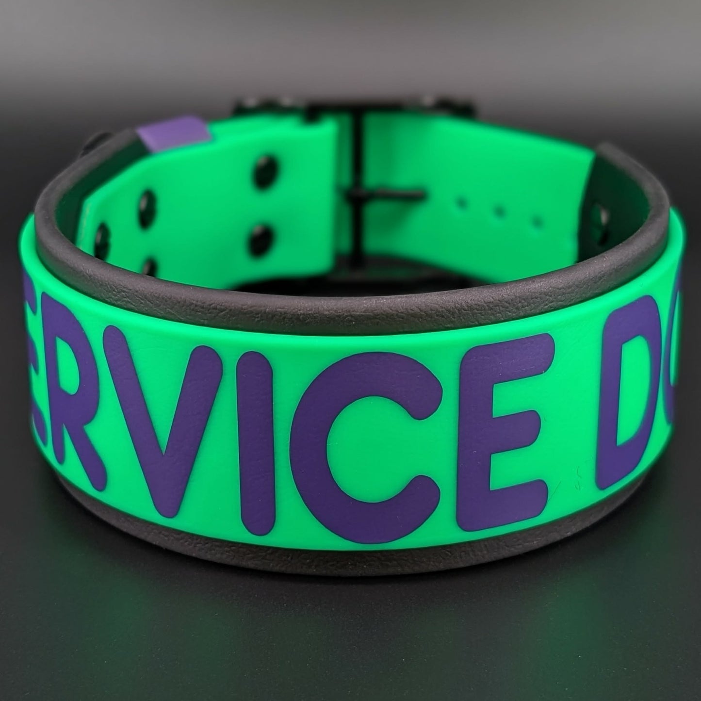 2 inch wide black and light green layered biothane service dog collar with dark purple text