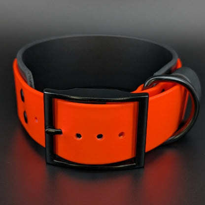 2 inch wide black and orange layered biothane dog collar with black hardware