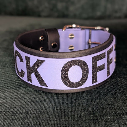 2 inch wide black and periwinkle blue layered biothane dog collar with black glitter text FUCK OFF