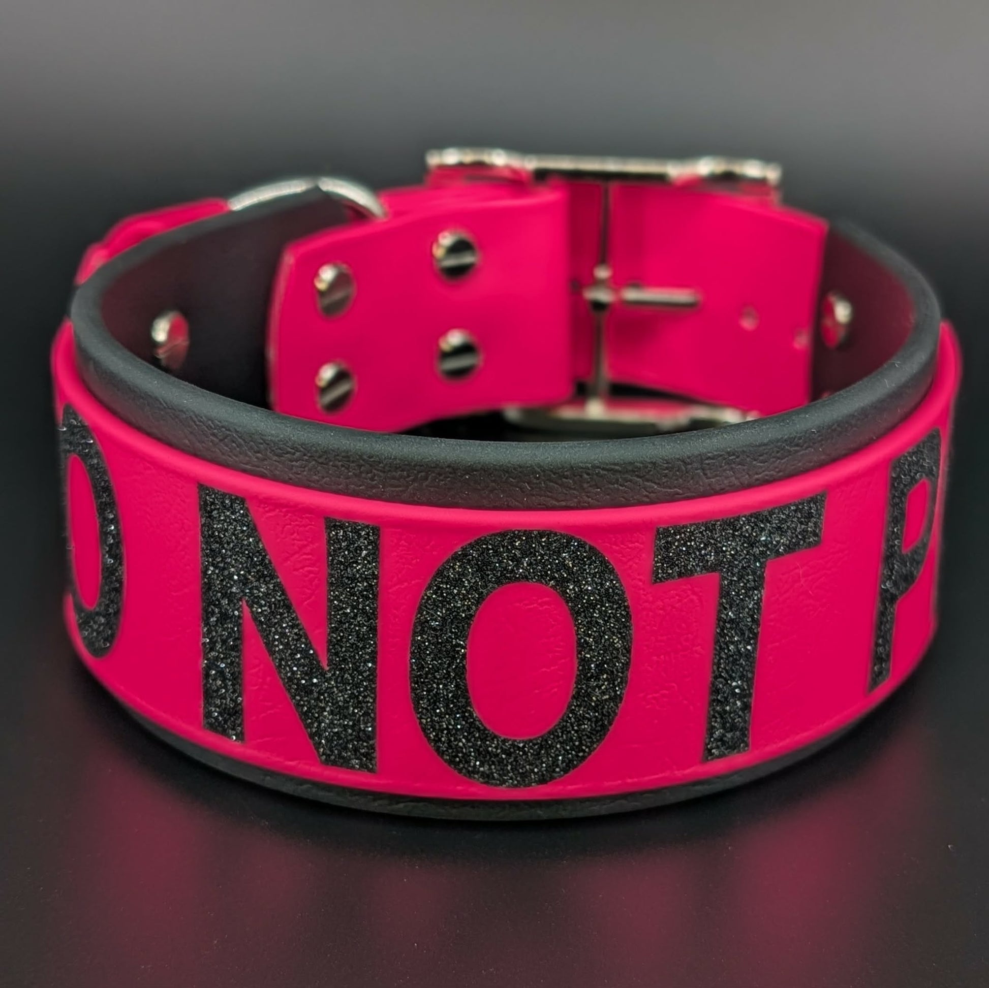 2 inch wide black and pink layered biothane collar with glitter do not pet text