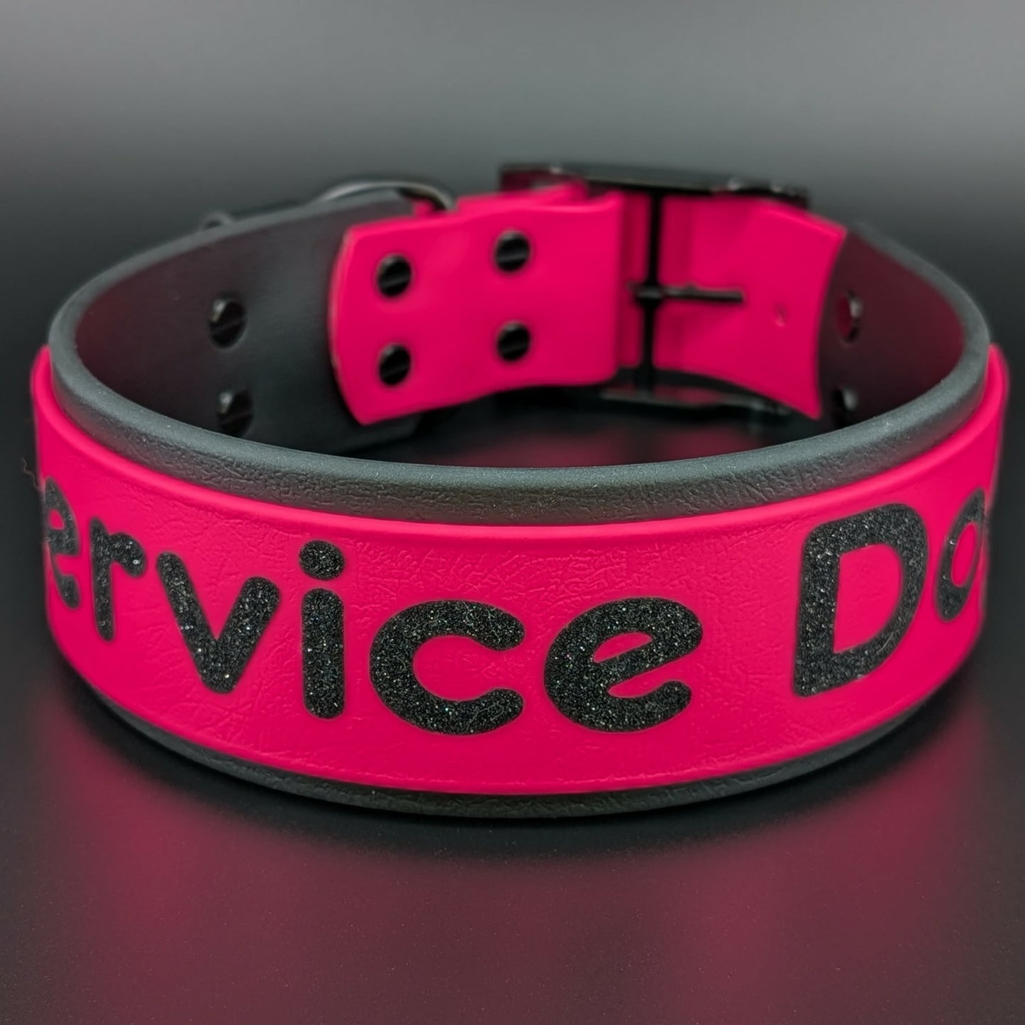 2 inch wide black and pink layered biothane collar with service dog glitter text