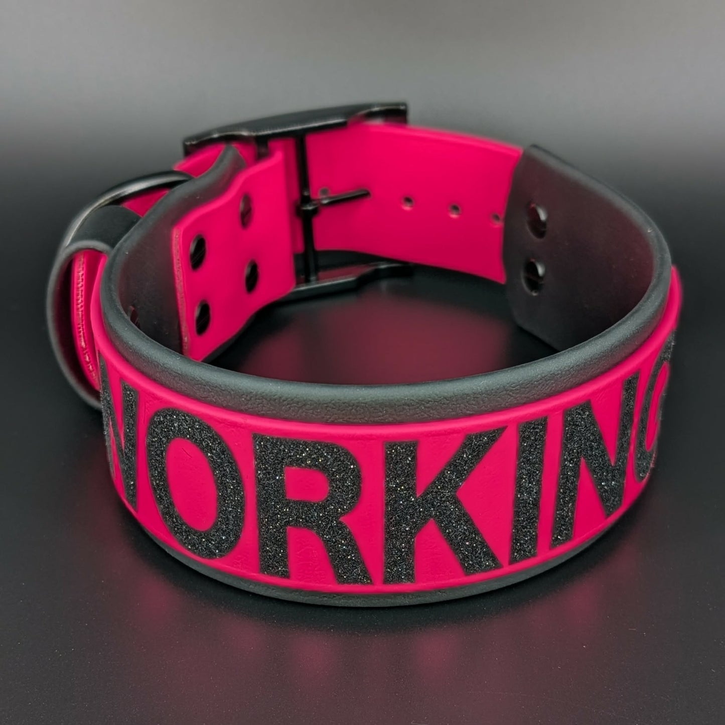 2 inch wide black and pink layered biothane dog collar with working k9 text
