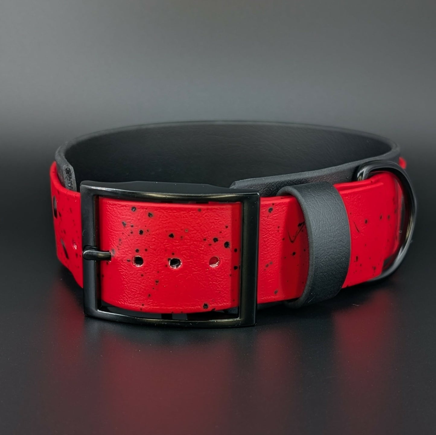 2 inch wide black and red biothane dog collar with splatter paint