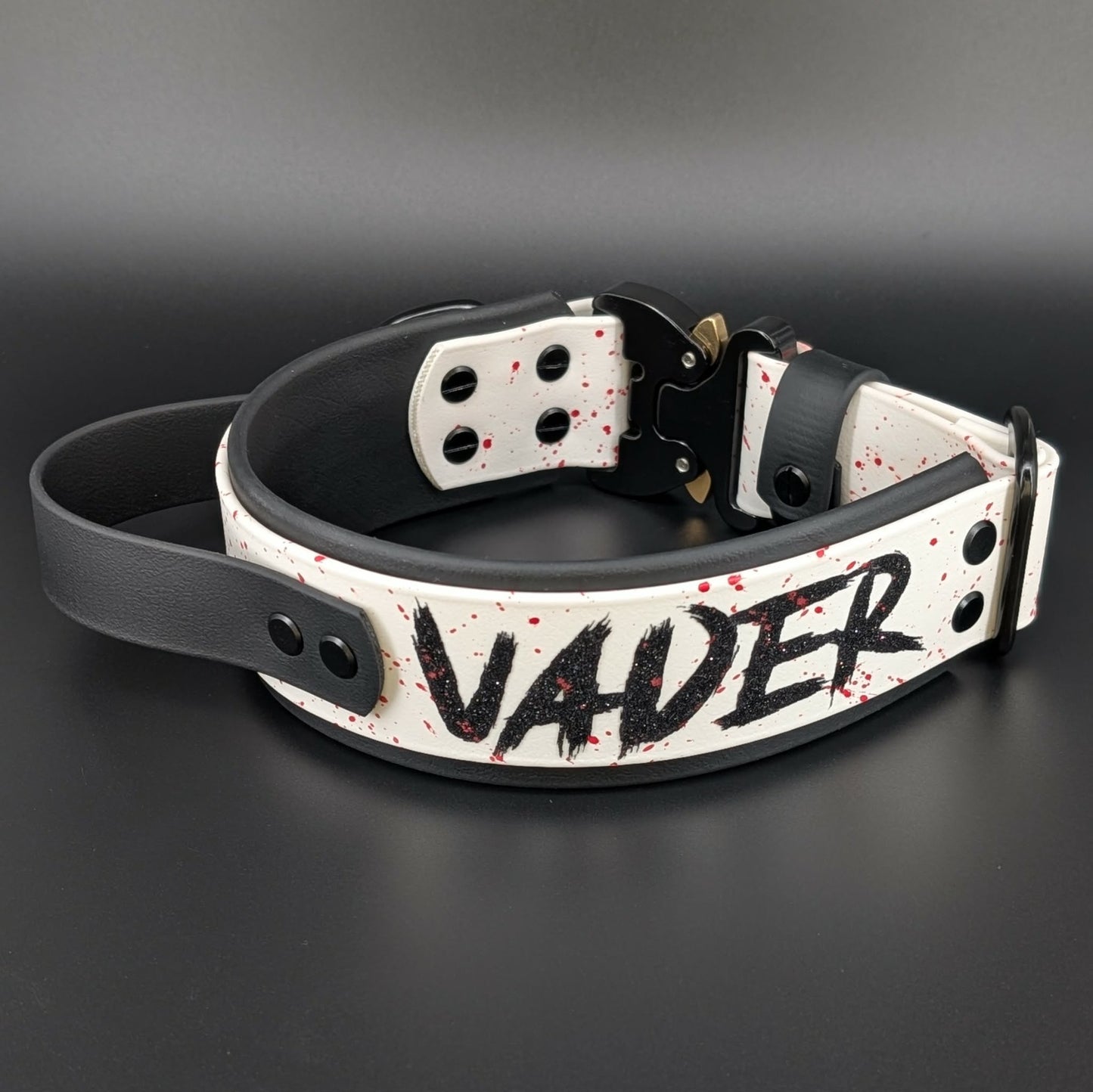 2 inch wide black and white layered biothane dog collar with tactical handle splatter paint and cobra buckle