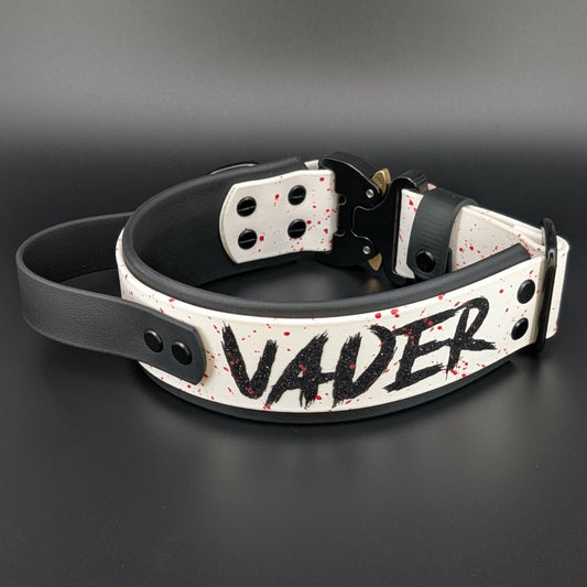 2 inch wide black and white layered biothane dog collar with tactical handle splatter paint and cobra buckle