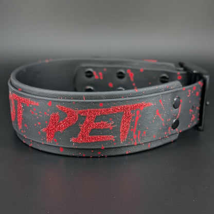 2 inch wide black layered biothane dog collar with black hardware and red glitter do not pet text
