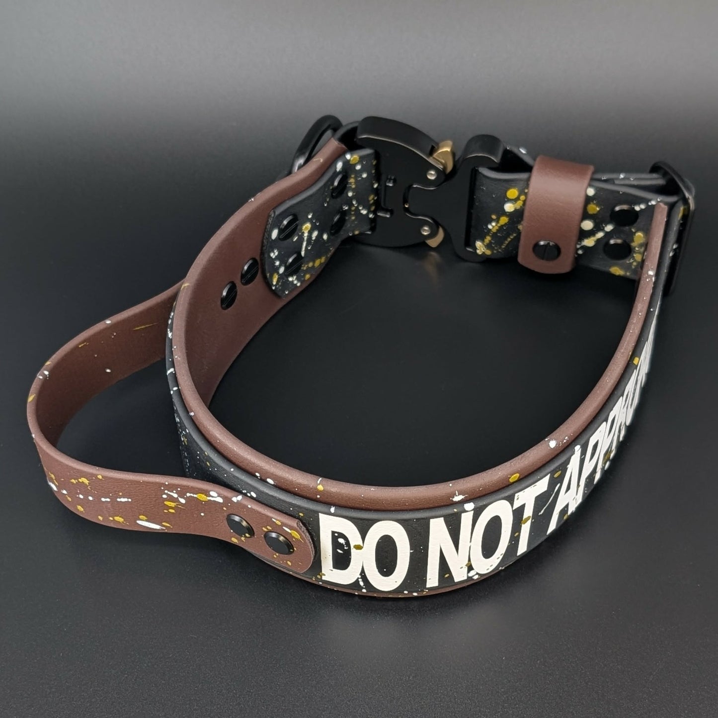 2 inch wide brown and black biothane dog collar with handle and cobra buckle and splatter paint