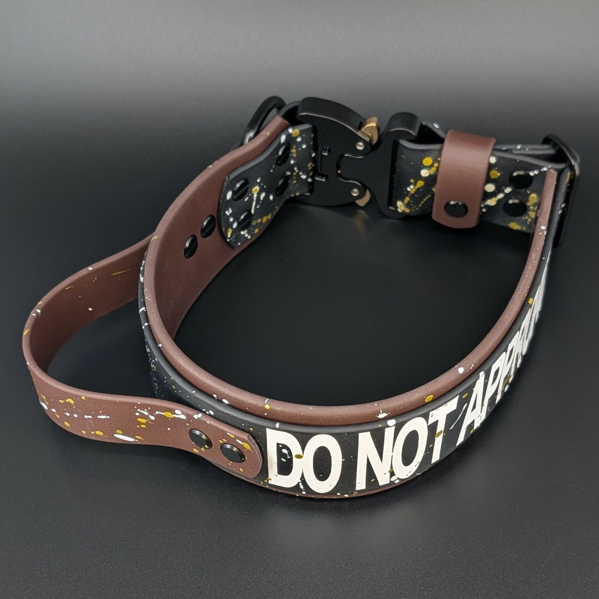 2 inch wide brown and black biothane dog collar with handle and cobra buckle and splatter paint
