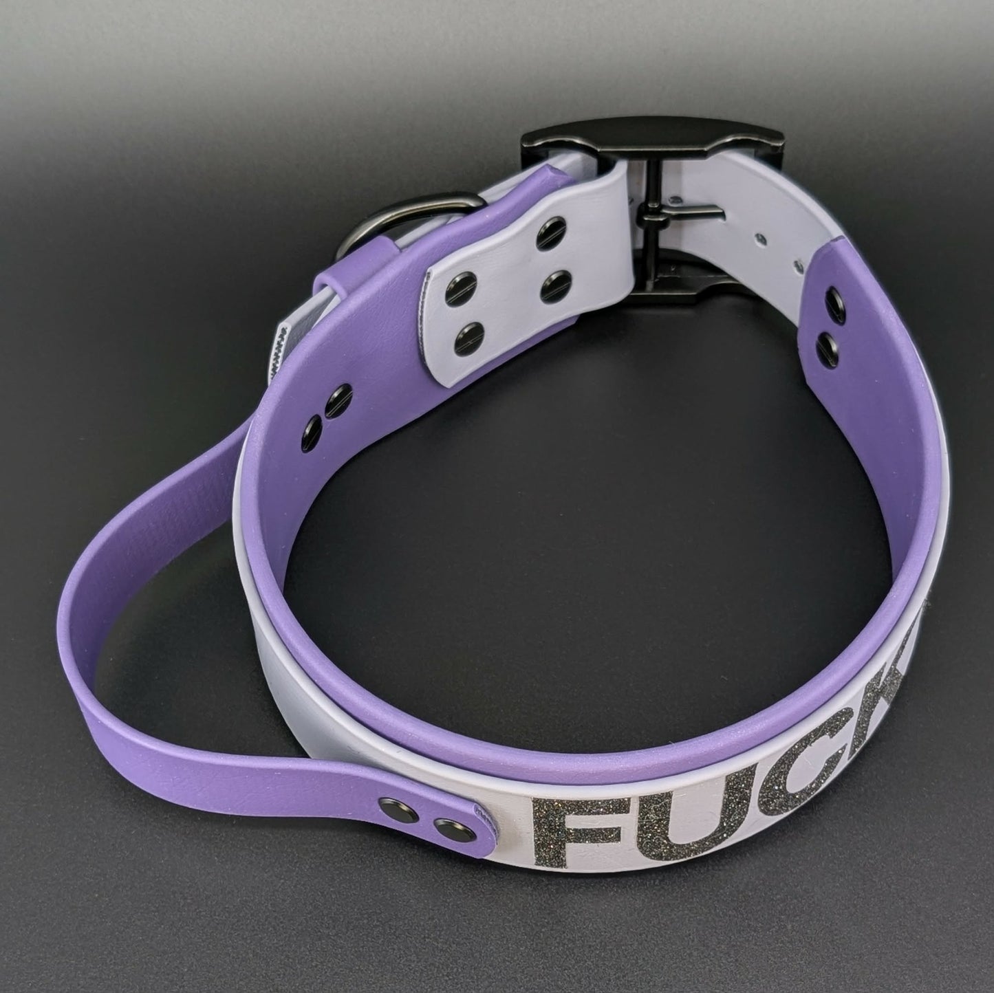 2 inch wide dark purple and gray layered biothane dog collar with tactical handle and fuck off text