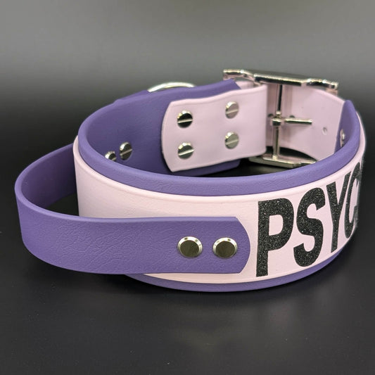2 inch wide dark purple and lavender biothane tactical handle dog collar with psycho glitter text
