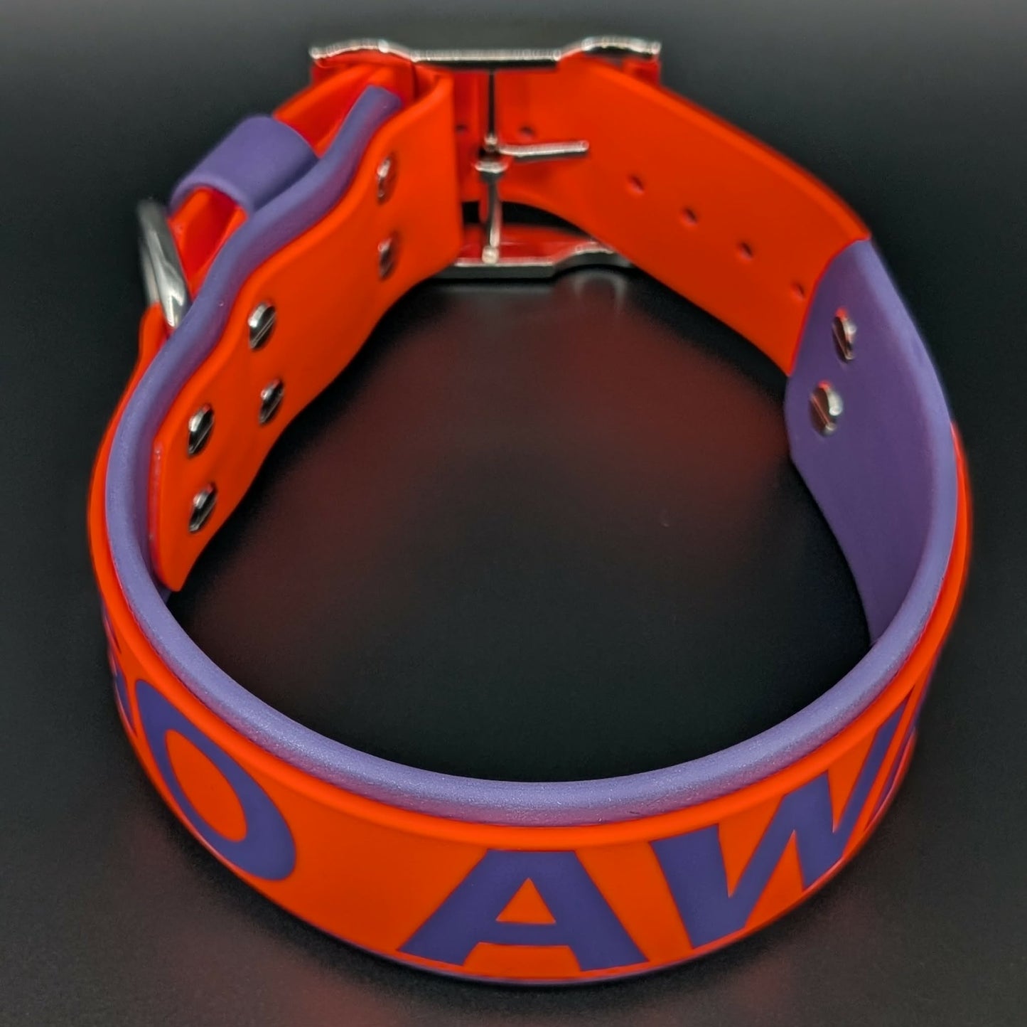 2 inch wide dark purple and orange layered biothane dog collar with go away text
