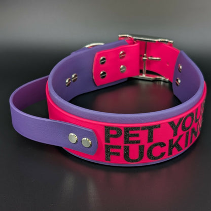 2 inch wide dark purple and pink layered biothane tactical handle dog collar with pet your own fucking dog text