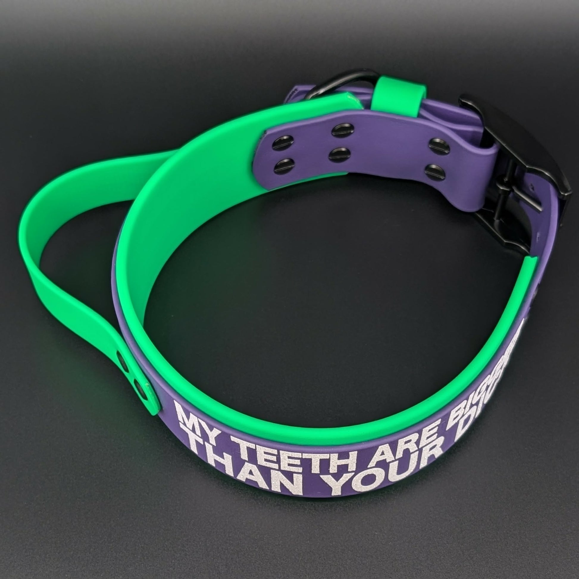 2 inch wide green and purple layered biothane handle collar with glitter my teeth are bigger than your dick text