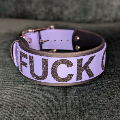 2 inch wide black and periwinkle blue layered biothane dog collar with black glitter 'FUCK OFF' text