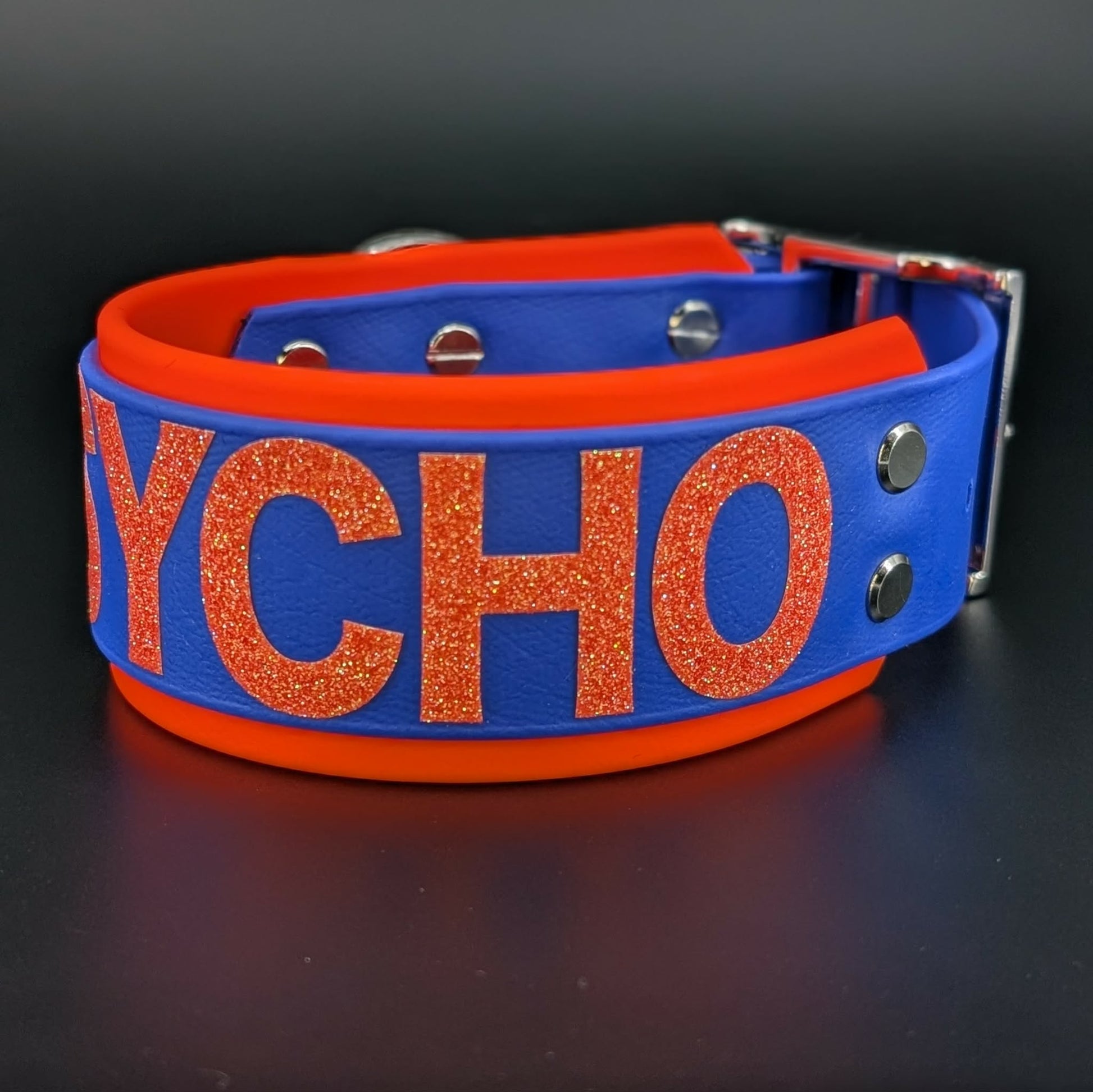 2 inch wide orange and royal blue biothane psycho collar glitter text
