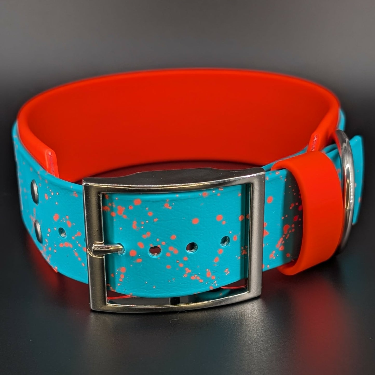 2 inch wide orange and teal layered biothane dog collar with splatter paint