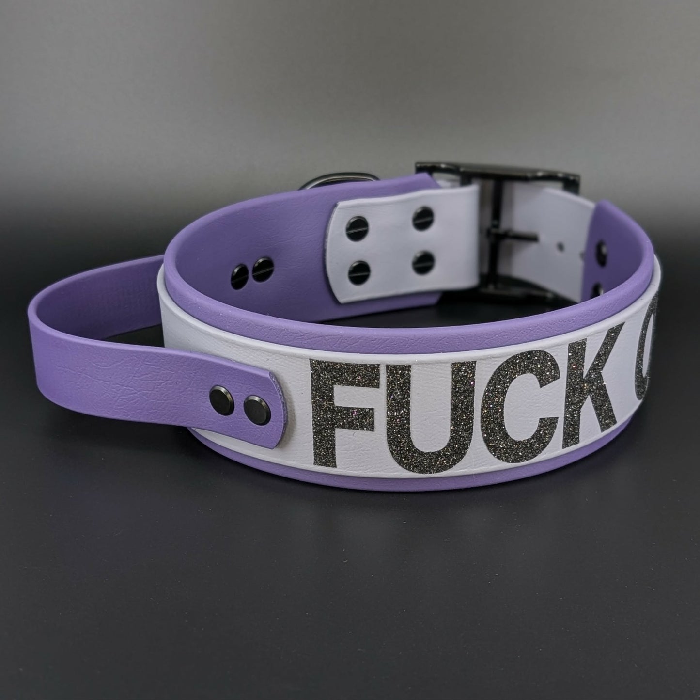 2 inch wide purple and gray layered biothane dog collar with tactical handle and fuck off glitter text