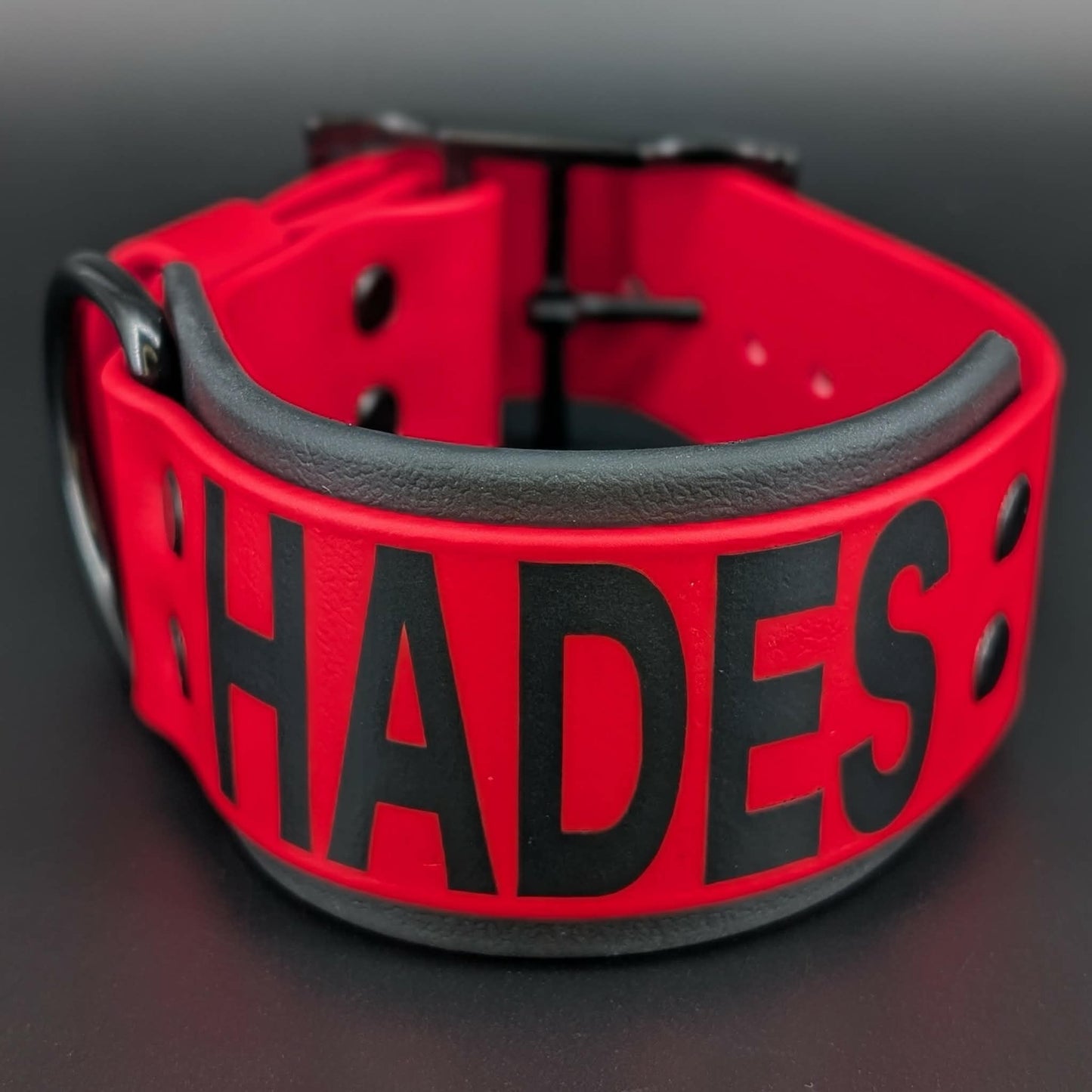 2 inch wide red and black layered biothane dog collar with custom text reading hades