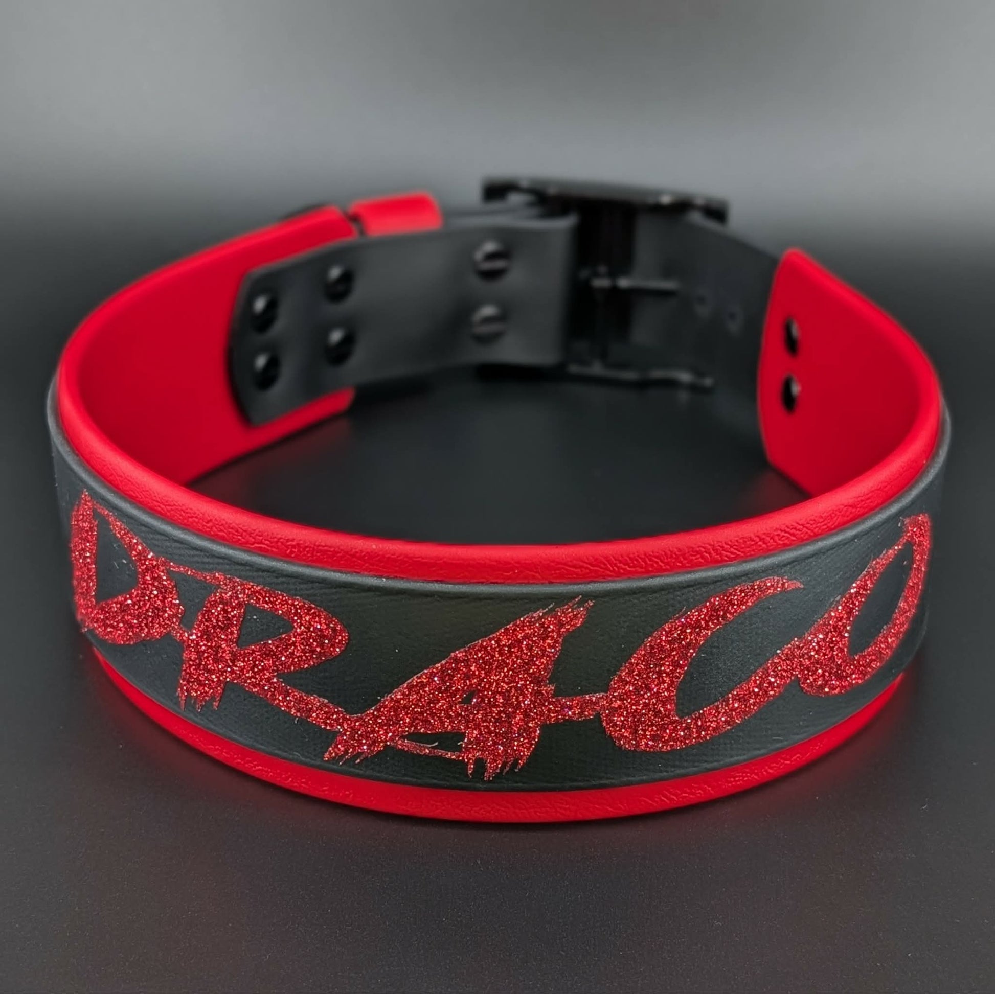 2 inch wide red and black layered biothane dog collar with personalized text reading draco