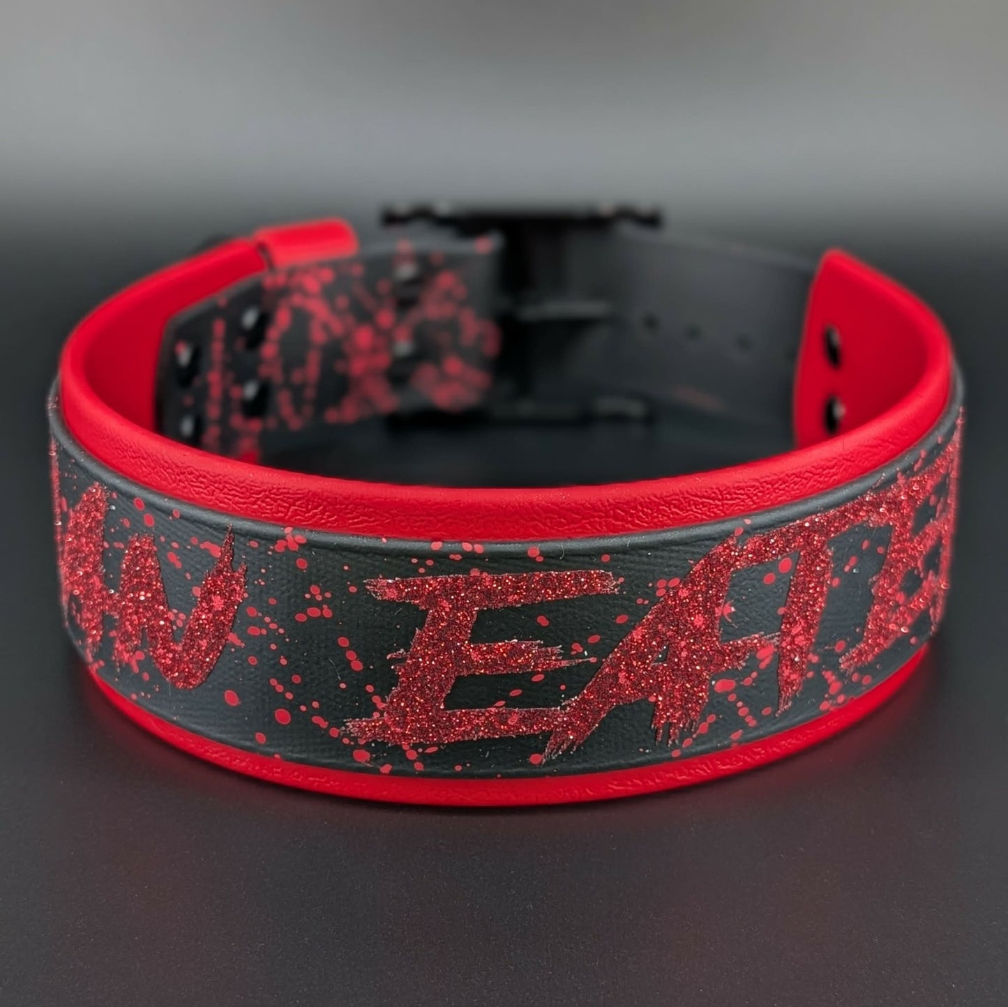 2 inch wide red and black layered biothane man eater collar with red splatter paint