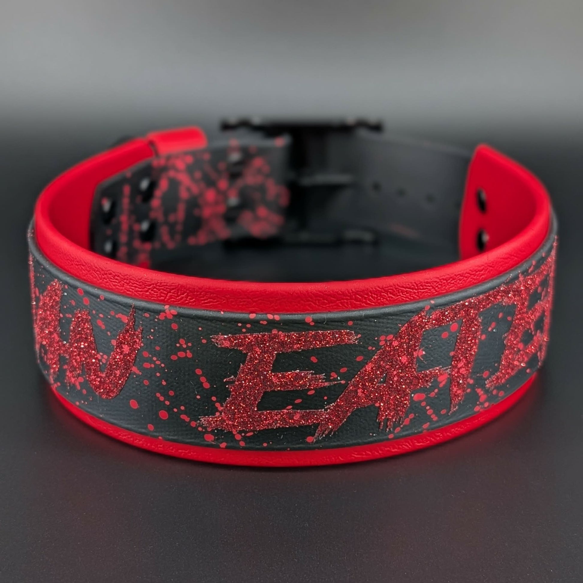 2 inch wide red and black layered biothane man eater collar with red splatter paint