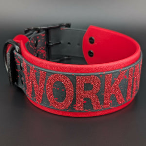 2 inch wide red and black layered biothane working k9 collar with black hardware and red splatter paint