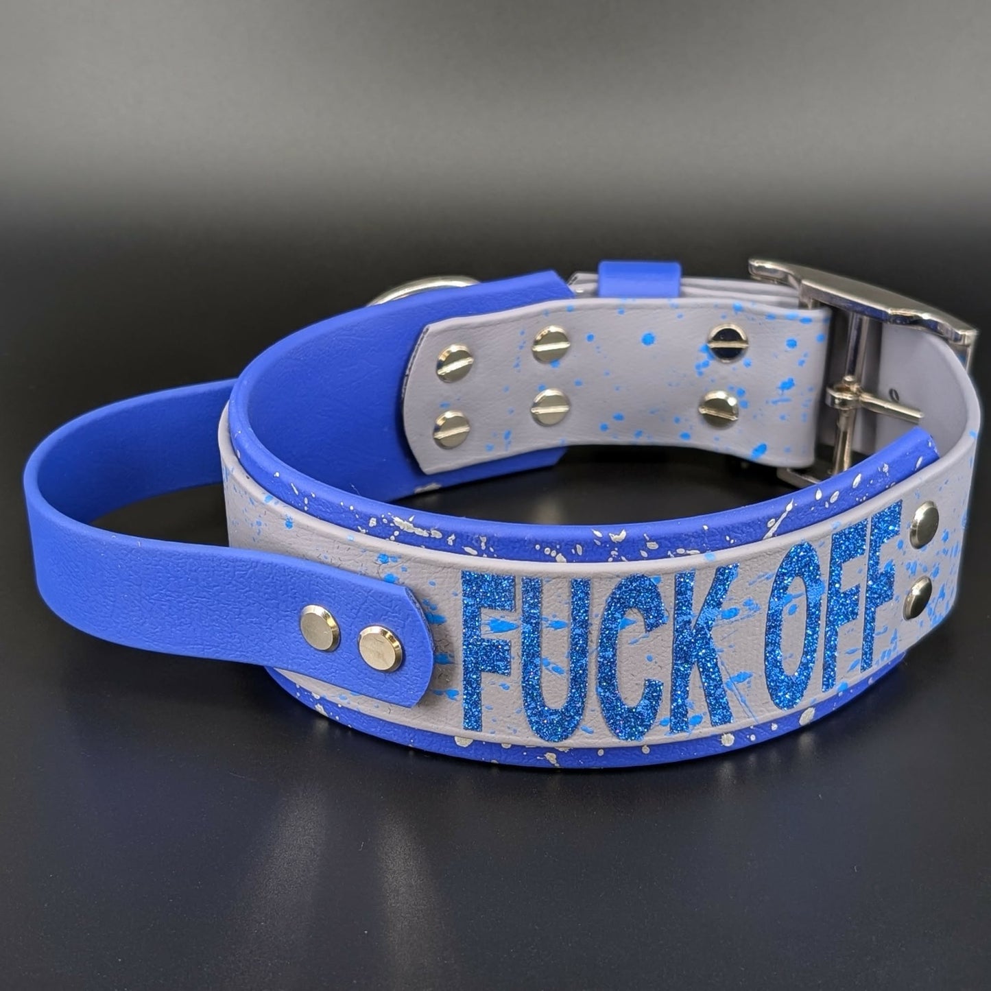 2 inch wide royal blue and gray layered biothane dog collar with tactical handle glitter text and splatter paint