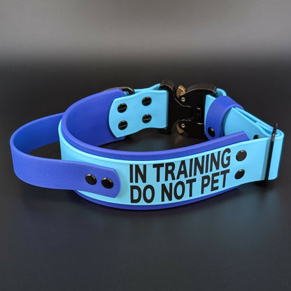 2 inch wide royal blue and light blue layered biothane collar with tactical handle in training do not pet text and quick release cobra buckle