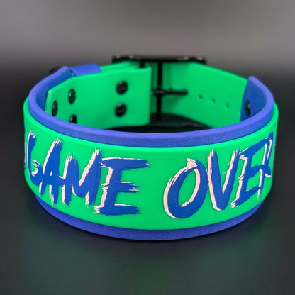 2 inch wide royal blue and light green layered biothane dog collar with game over text