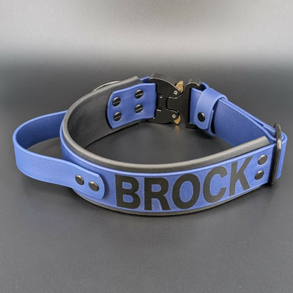 2 inch wide tactical handle dog collar with quick release cobra buckle and personalized text reading brock