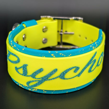 2 inch wide teal and yellow layered biothane collar with splatter paint and glitter psycho text
