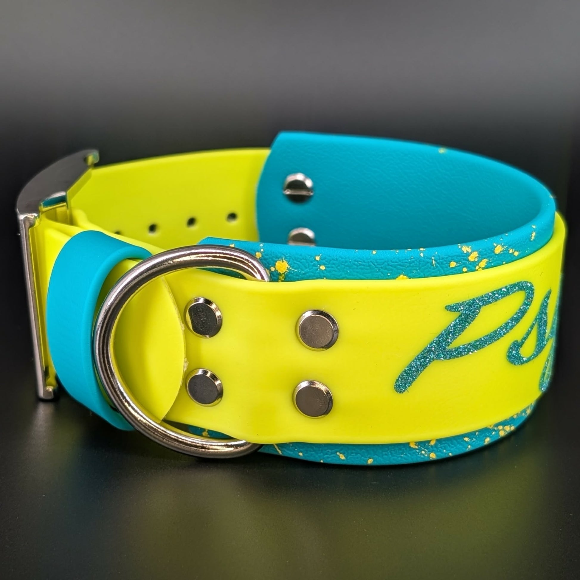 2 inch wide teal and yellow layered biothane dog collar with splatter paint and glitter psycho text