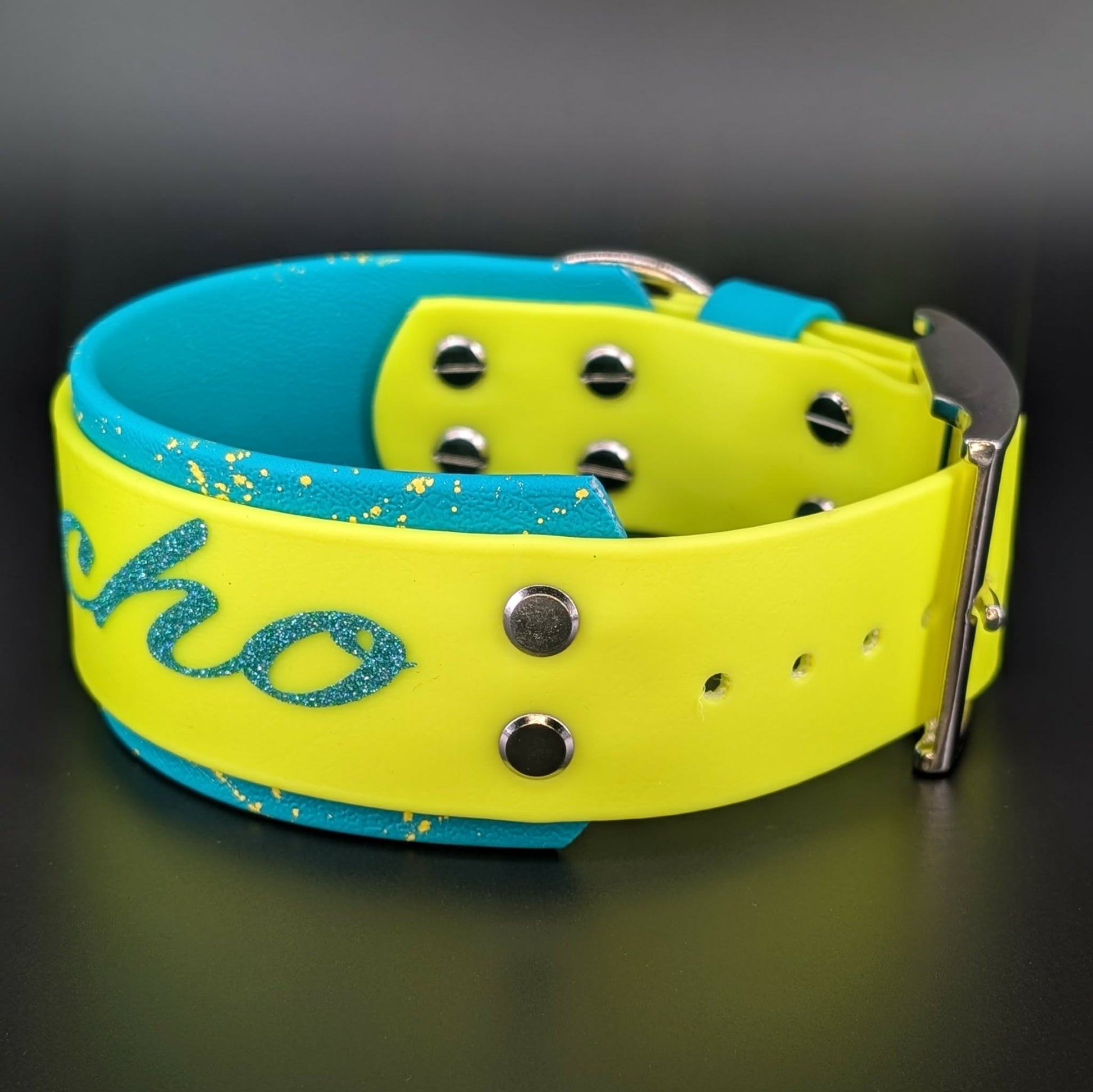 2 inch wide teal and yellow layered biothane dog collar with splatter paint and psycho text